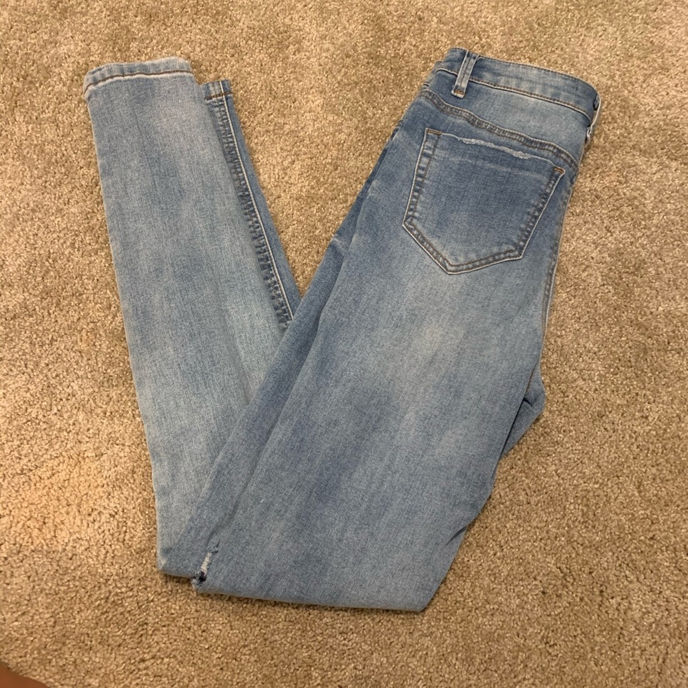 High waisted ripped light wash jeans